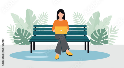 Young woman working on laptop computer while sitting on park bench outdoors