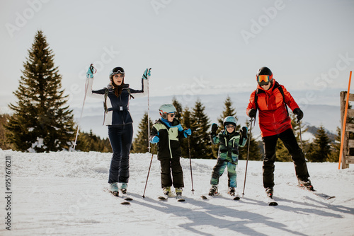 Family enjoys skiing on a s...