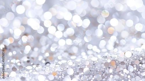 Soft white and silver bokeh lights create gentle sparkle. Delicate silver and white glitter particles shimmer softly. Background features soft focus circular lights. Perfect for holiday, wedding