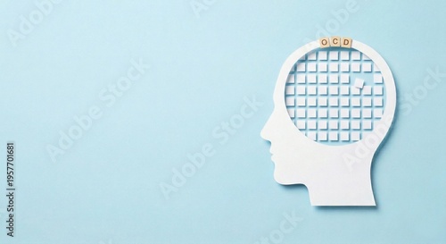 OCD awareness concept with rigid grid and misplaced tile in human head profile