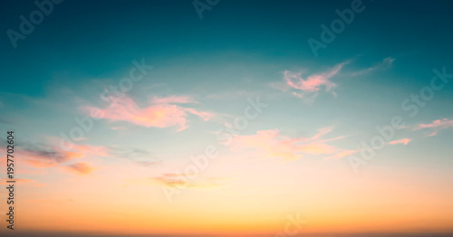 Pastel sunset sky panorama with pink and orange clouds, sky replacement background banner with copy space