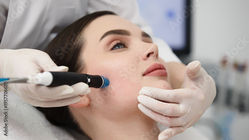 Female patient receiving hydrafacial treatment in a beauty clinic, with a technician applying a device to her face while wearing gloves and a white coat