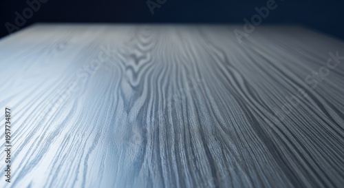 Close-up of a light-colored wooden surface with prominent grain patterns.