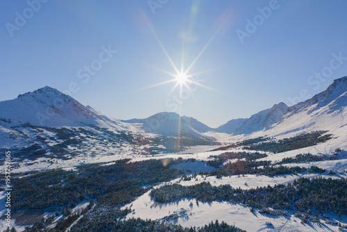 Aerial view of snow-covered Chugach Mountains and Flattop Mountain in Alaska.