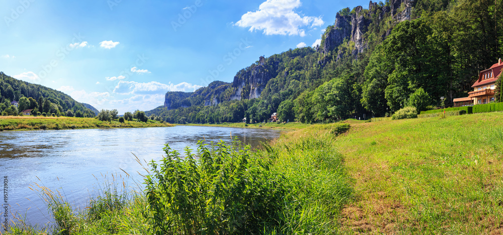 Naklejka premium Beautiful landscape, panorama, banner - View of the Elbu River and the Elbe Sandstone Mountains near the village of Rathen, in Saxony, Germany