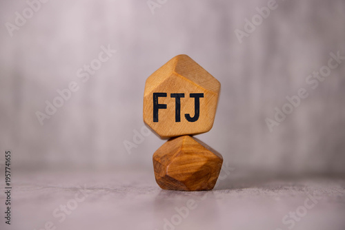 Valokuva FTJ. text on wood cubes. text in black letters on wood blocks