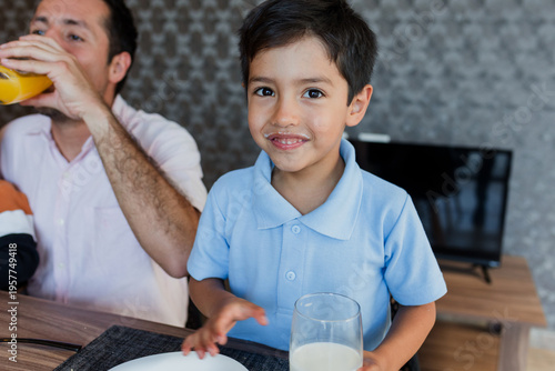Konstfotografi latin little boy child having breakfast at home in Mexico Latin America, hispani