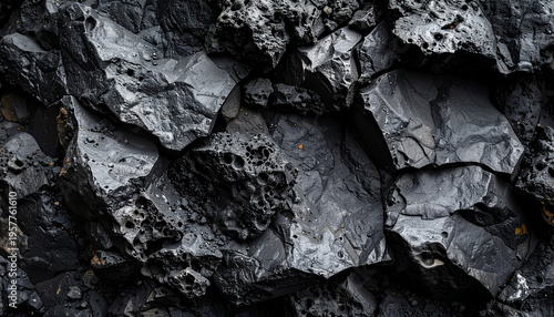 Charcoal grey cracked stone surface with deep weathered fissures