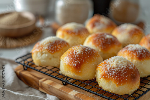 Fluffy buns glimmer with powdered sugar