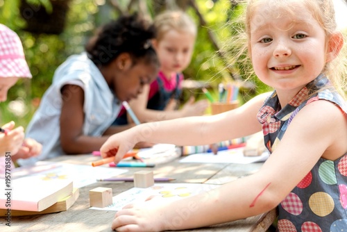 Quadro su tela Children enjoying outdoor art activities.