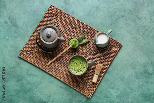Wicker mat with cup of tast...