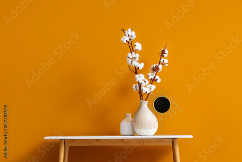 Vases with cotton flowers a...