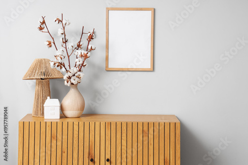 Vase with cotton flowers an...