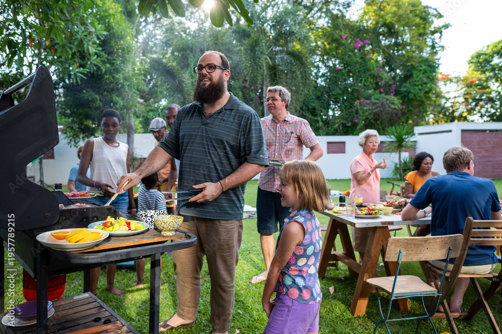 Obraz premium Joyful backyard family barbecue gathering