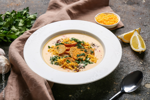 Bowl of tasty cheese soup w...