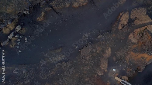 drone shot of a bridge between continents in Iceland black soil