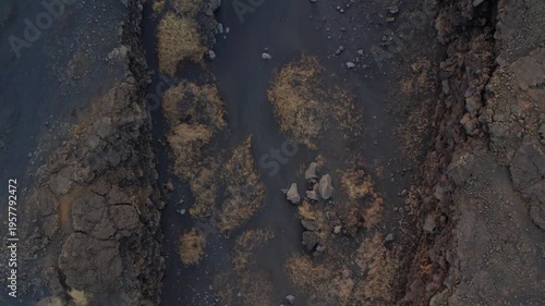 drone shot of a bridge between continents in Iceland black soil