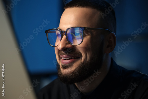 Happy male trader with eyeg...