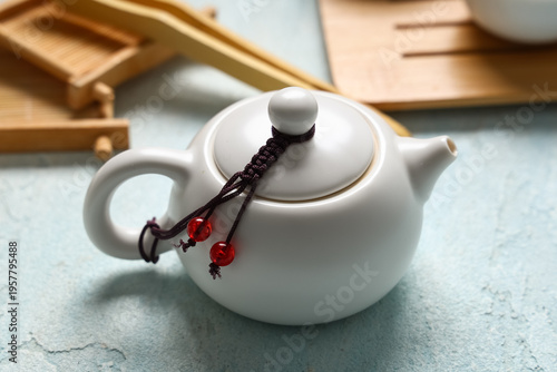 Teapot of tea on light blue...