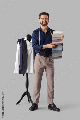 Male tailor with fabric sam...