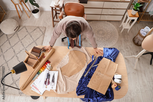Male tailor working at tabl...
