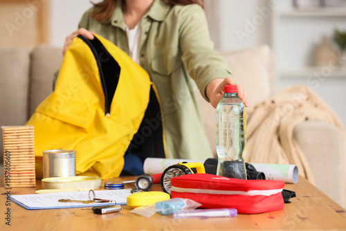 Woman packing emergency bac...