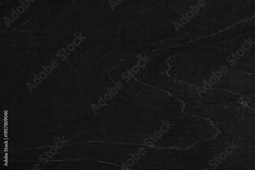 Dark black wood texture, revealing it's natural grain, patterns, and rustic details.