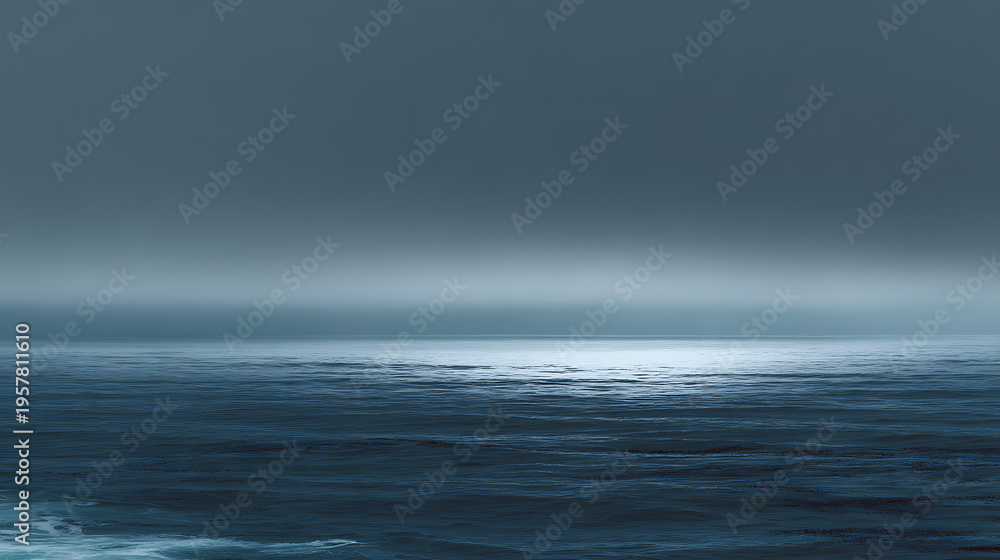 Fototapeta premium A calm ocean with a cloudy sky in the background