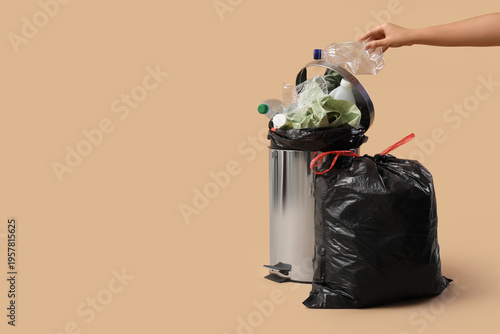 Woman throwing plastic bott...