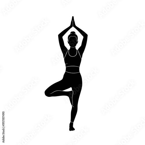 Woman in yoga tree pose silhouette.