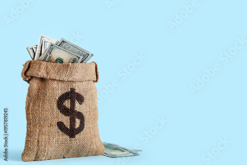 Bag full of money on blue b...