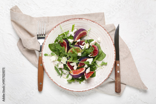 Plate of tasty fig salad on...