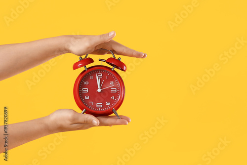 Female hands with alarm clo...
