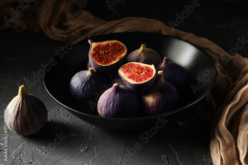 Bowl with fresh ripe figs o...
