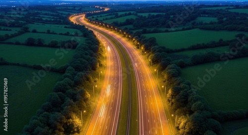 Illuminated Highway At Dusk Amidst Verdant Countryside