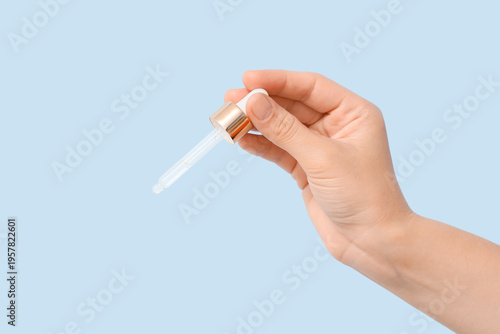 Female hand with essential ...