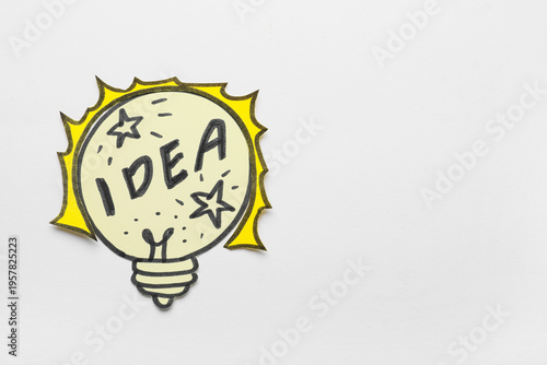 Paper light bulb with word ...
