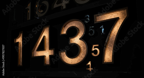 Close up of golden numerals set against a dark background with artistic lighting