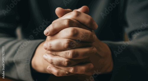 Close up of hands clasped together suggesting contemplation and reflection