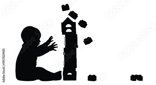 A young child reaches for tumbling blocks a dark silhouette