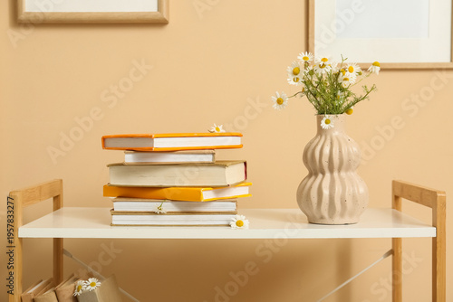 Vase with chamomiles and bo...