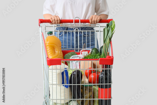 Woman with shopping cart fu...