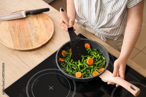 Woman with spatula frying t...