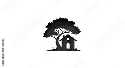 Silhouette of a House Under a Large Tree