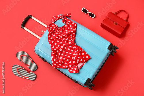 Blue suitcase, swimsuit and...