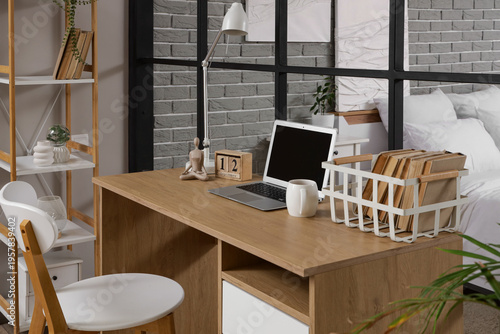 Workplace with blank laptop...