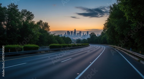 Majestic Cityscape Revealed As Freeway Winds Towards Distant Skyline At Dawn