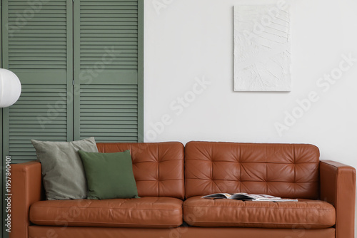 Brown leather sofa with sof...