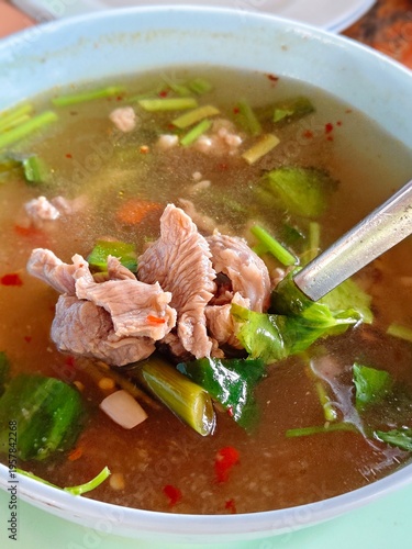 Thai spicy and sour pork soup with herbs, known as Tom Saap.
