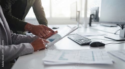 Konstfotografi Business professionals collaborating and analyzing financial data on a digital tablet in a modern office